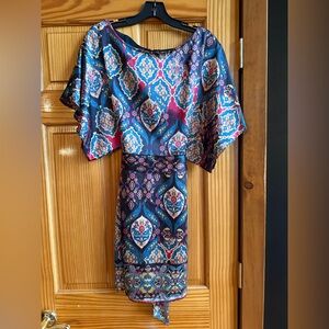 Gently worn. Stunning tie back kimono style dress.
